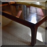 F06. Asian-inspired coffee table with gold border. 18”h x 48”w x 28”d 